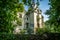 Old castle lost in the forest with trees inside