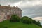 Old castle stands on a green hill