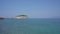 Old castle with turkish flag on sea cape in Kusadasi city of Turkey.