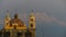 Old cathedral with snowy volcano