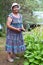 Old Caucasian lady with garden pruner in her hands, grandma works in spring season