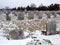 Old cemetery gravestones with snow