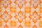 Old ceramic tile background. Bright orange tile paving in arabic style. Oriental floor decor.