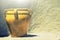 Old ceramics terracotta vase light brown yellow. Background stone wall