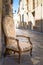 Old chair in a traditional street of Lecce, Italy.