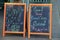 Old chalkboard menus outside restaurant