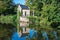 Old chapel reflecting in the water of the river Dender, Geraardsbergen, Flemish Region, Belgium