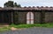 Old Chicken Coop with Unusual White and Red Shutters