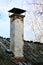 Old Chimney on a wooden lath roof