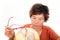 An old Chinese lady carefully looking at the globe in front of a white background