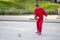 Old Chinese woman whipping spinning tops, traditional Chinese game, Beijing, China