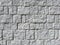 Old chipped white brick wall texture