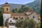 The old church against the backdrop of high steep mountains