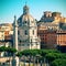 The old church and ancient Trajan\'s Column in Rome