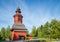 Old church bell tower next to cemetery