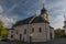 Old church with blue sky in Besiny village in autumn evening