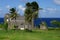 An old church building on the seashore surrounded with tropical palm trees, St. Kitts Island