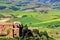 Old church and farm fields in Montalcino town, Val d`Orcia, Tusc