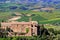 Old church and farm fields in Montalcino town, Val d`Orcia, Tusc