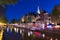 Old Church Oude Kerk and Amsterdam canals at night, Netherlands