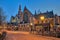 The old church Oude Kerk in Amsterdam city at night, Netherlands