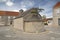 Old church of Saint Peter and Paul with pine tree in the roof in Nerezisca island Brac, Croatia