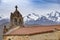 Old church steeple and mountains