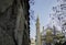 Old church tower with a minaret close together