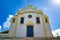 Old church view with stairs, with clouds and blue sky behind