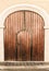 Old church wood textured door with stone arch