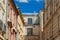 Old city back street houses walls corner with symmetry background facade view