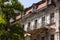 Old city buildings before and after restavration. Ancient windows, roofs, balconies. sculptures, walls