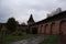 Old city landscape - the wall of the old red brick fortress, the long fortress wall and towers, the inner courtyard of the Kremlin