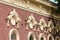 Old city, Prettily suburban town. Architectural details and decoration of the vintage stucco facade framing the windows - console