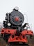 Old classic black soviet steam locomotive with red star on front