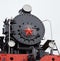 Old classic black soviet steam locomotive with red star on front, close up view on star