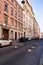 Old classic buildings on the street in Vienna. Architectural Classical Baroque Facades of beige and pale pink houses with stucco