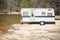 Old Classic Camper Trailer Near A River