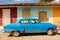 Old classic fifties car in a street of Trinidad