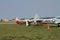 Old classic military planes lined up on field