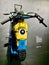 an old classic mini motorbike with minion colors