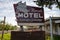 Old classic neon sign for the Arrowhead Motel, now abandoned