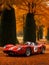 Old classic racing car in the autumn park. Fictional car. Generative AI