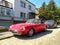 Old classic roadster sports car Alfa Romeo Spider 2000 left side and front part parked
