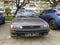 Old classic rusty small compact car Toyota Corolla from eighties parked