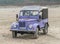 Old classic Soviet 4WD car GAZ-69 parked on a beach