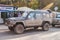 Old classic veteran black offroad big 4wd car Toyota Landcruiser with long exhaustion pipe parked