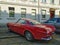 Old classic vintage car red Volvo P1800 coupe parked