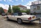 Old classic vintage ebony white Jaguar XJS 12V convertible parked