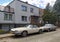 Old classic vintage ebony white Jaguar XJS 12V and Mercedes Benz 500 SLC 5 litre parked